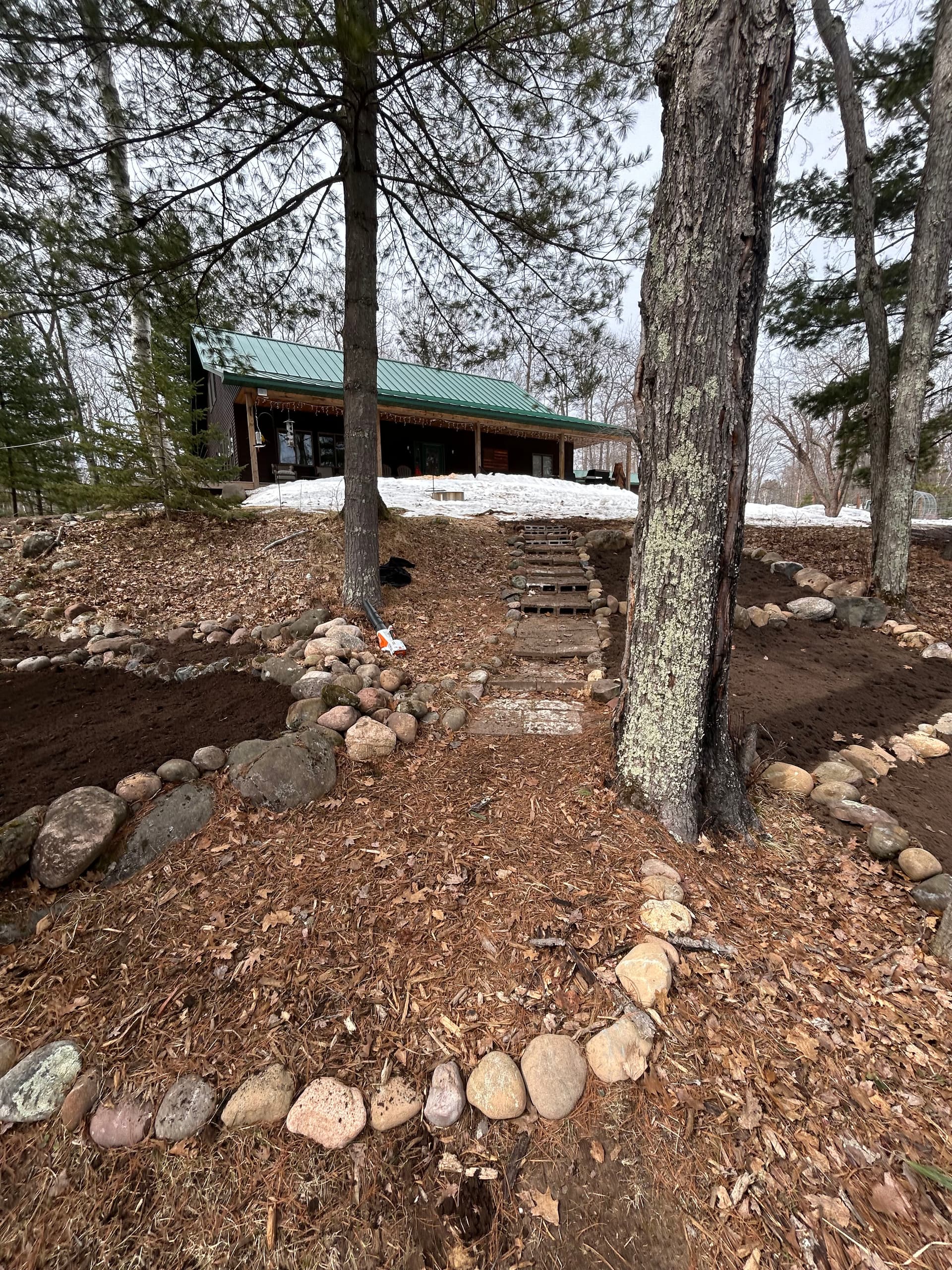 Garden Bed Construction and Stone Edging at a Wooded Cabin Property