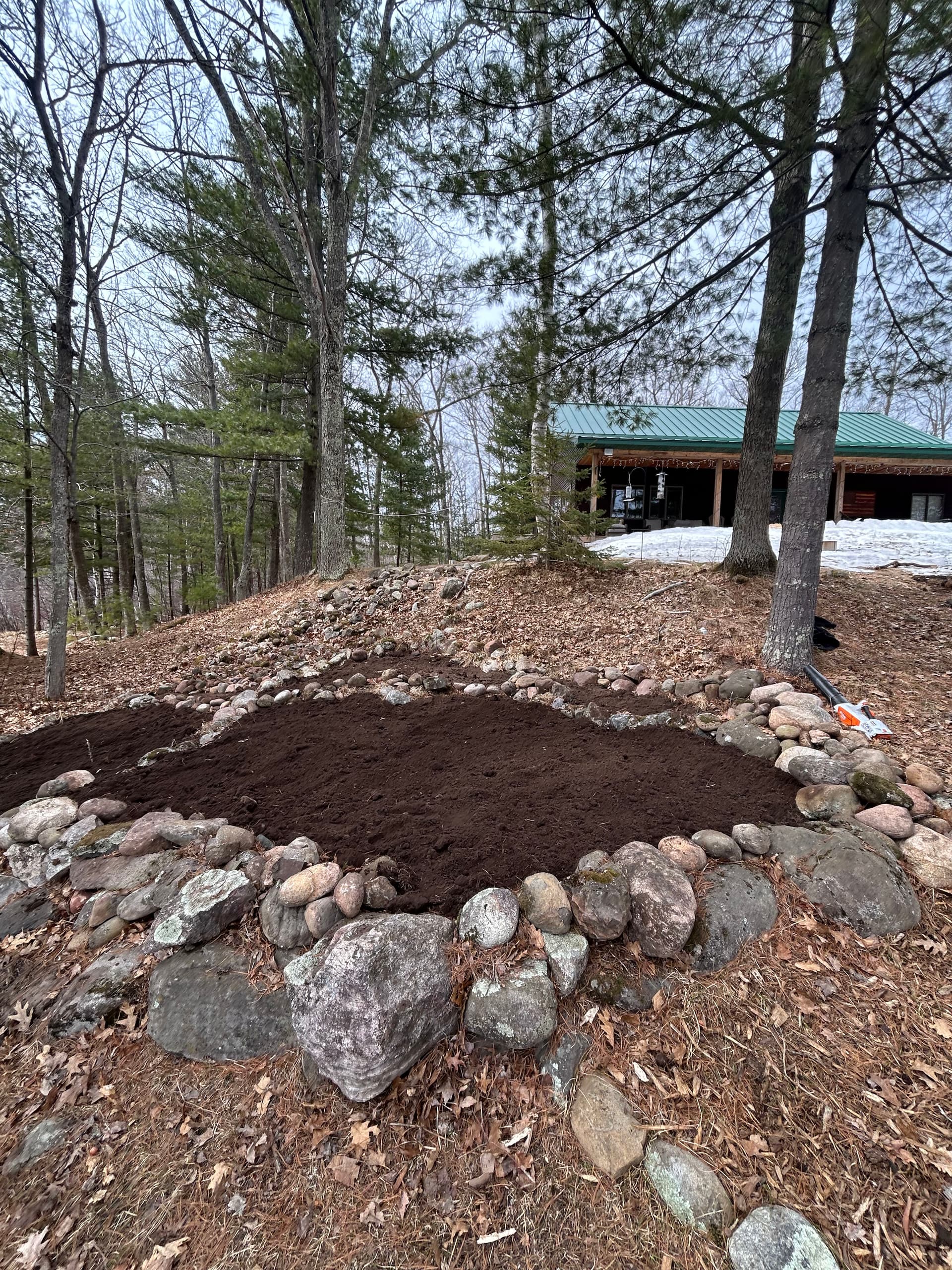 Garden Bed Construction and Stone Edging at a Wooded Cabin Property