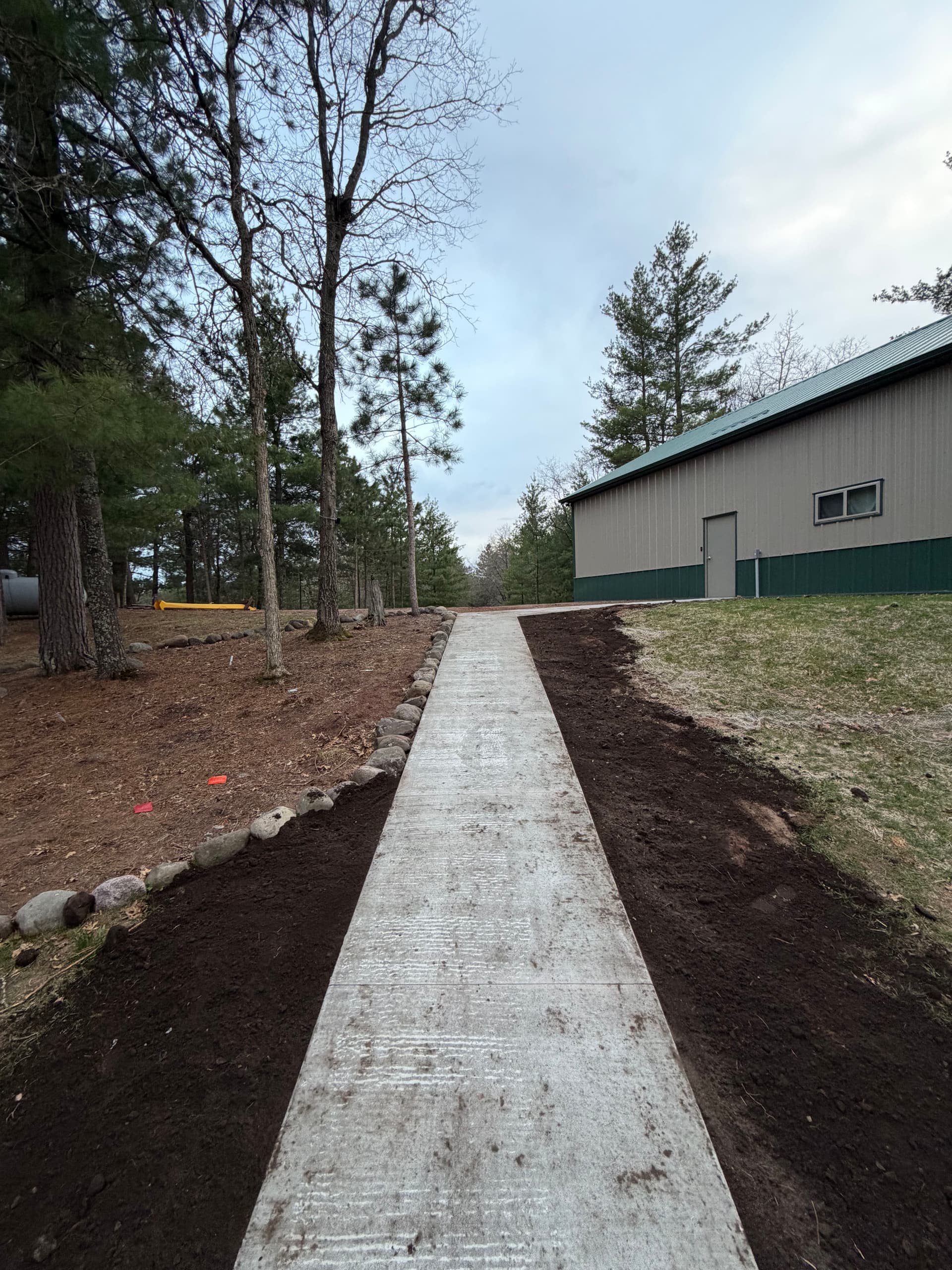 Gallery photos for New Concrete Walkway Connects Shop and Home on Lake Property: Image #1