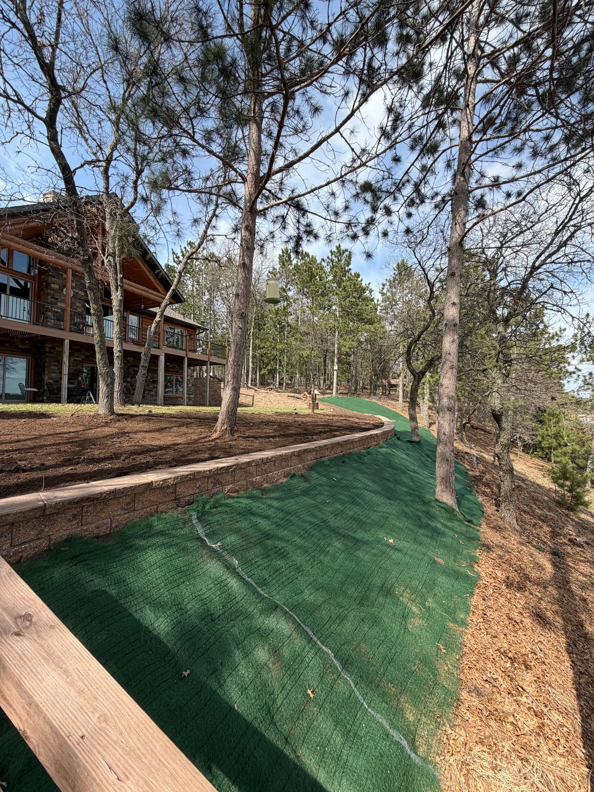 115-Foot Block Retaining Wall Replaces Failing Timber Wall on Eroding Hillside image