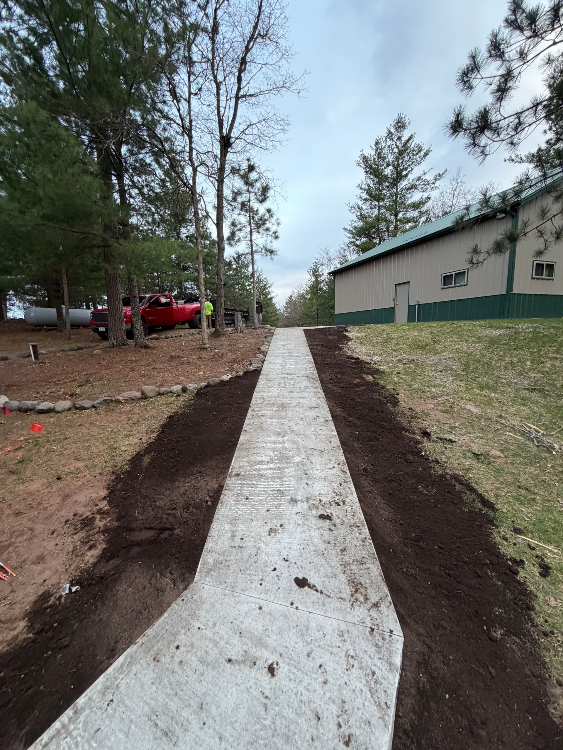 New Concrete Walkway Connects Shop and Home on Lake Property image