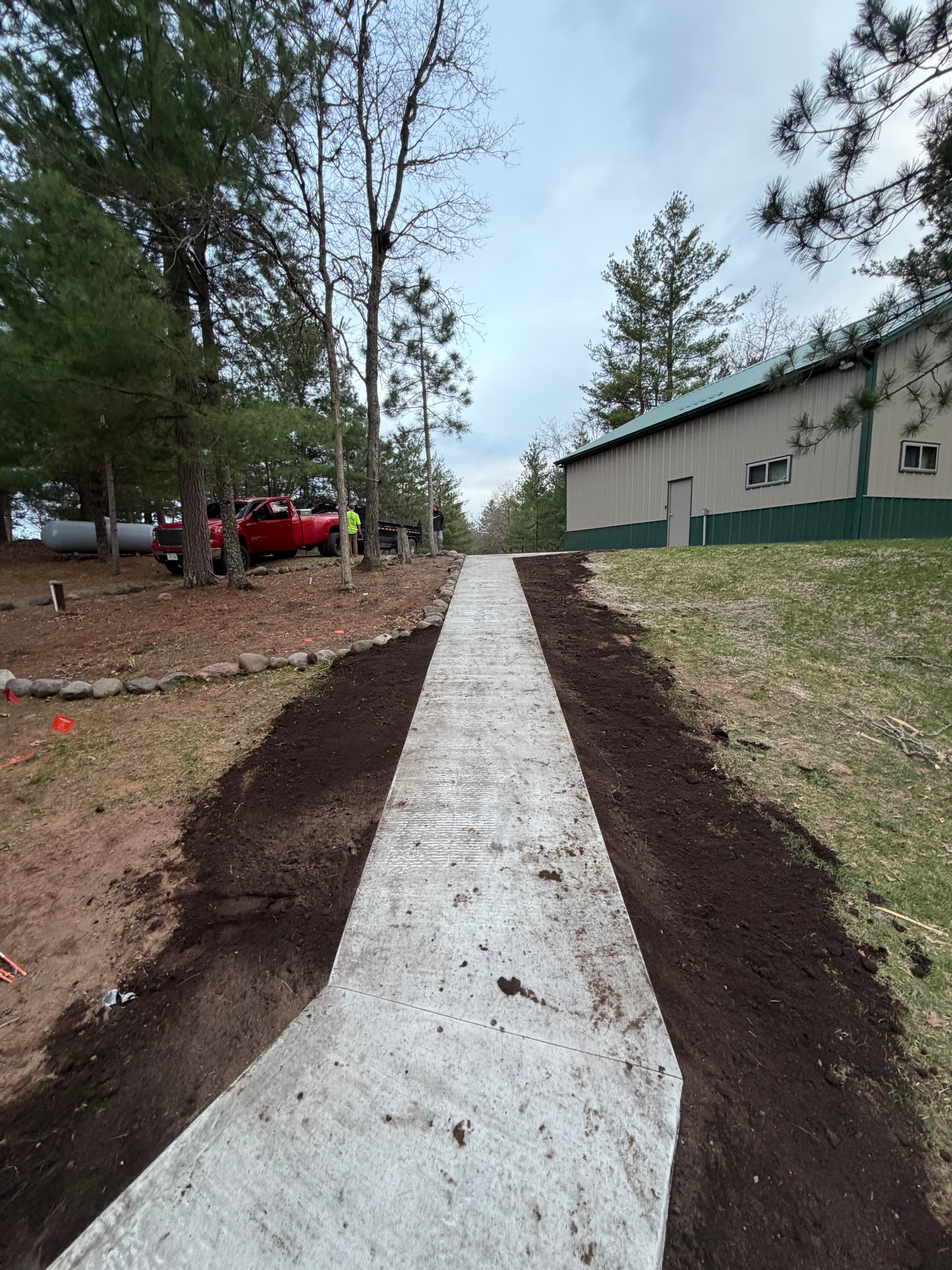 Project New Concrete Walkway Connects Shop and Home on Lake Property image