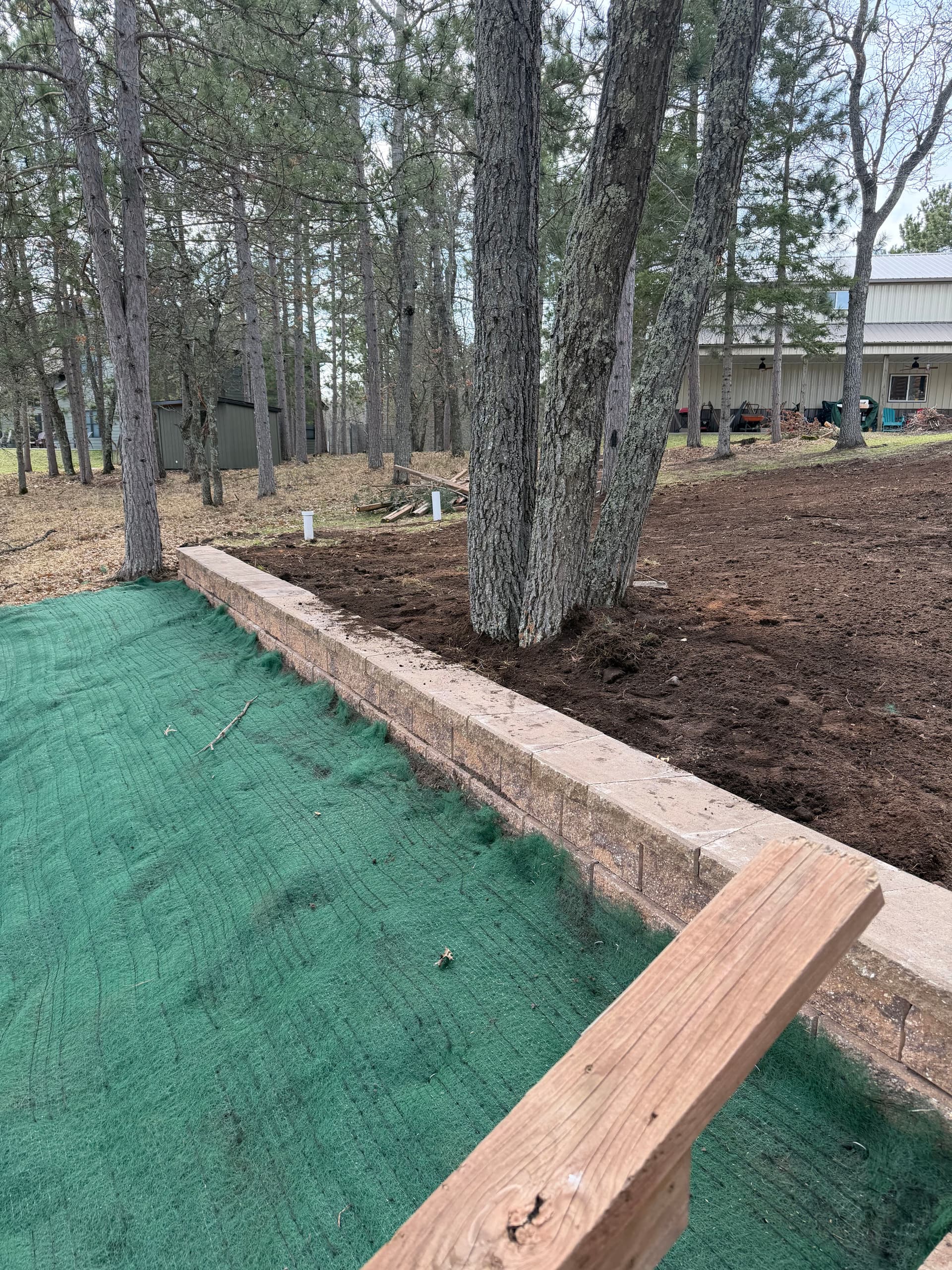 Gallery photos for 115-Foot Block Retaining Wall Replaces Failing Timber Wall on Eroding Hillside: Image #2