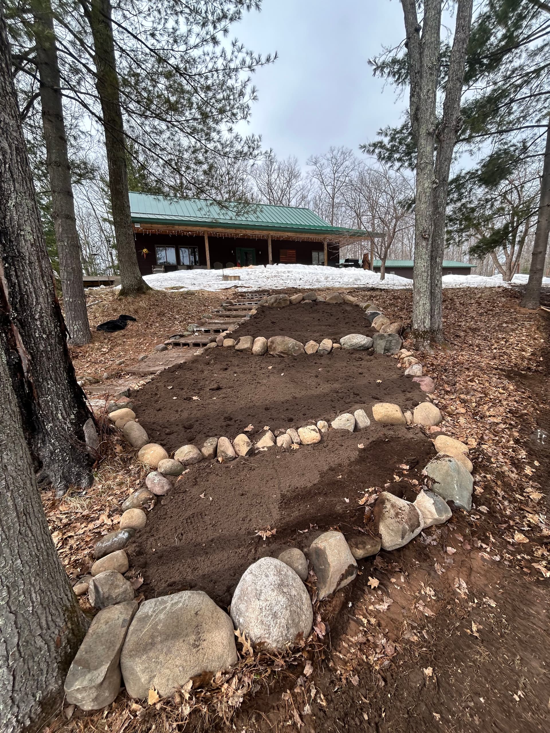 Garden Bed Construction and Stone Edging at a Wooded Cabin Property