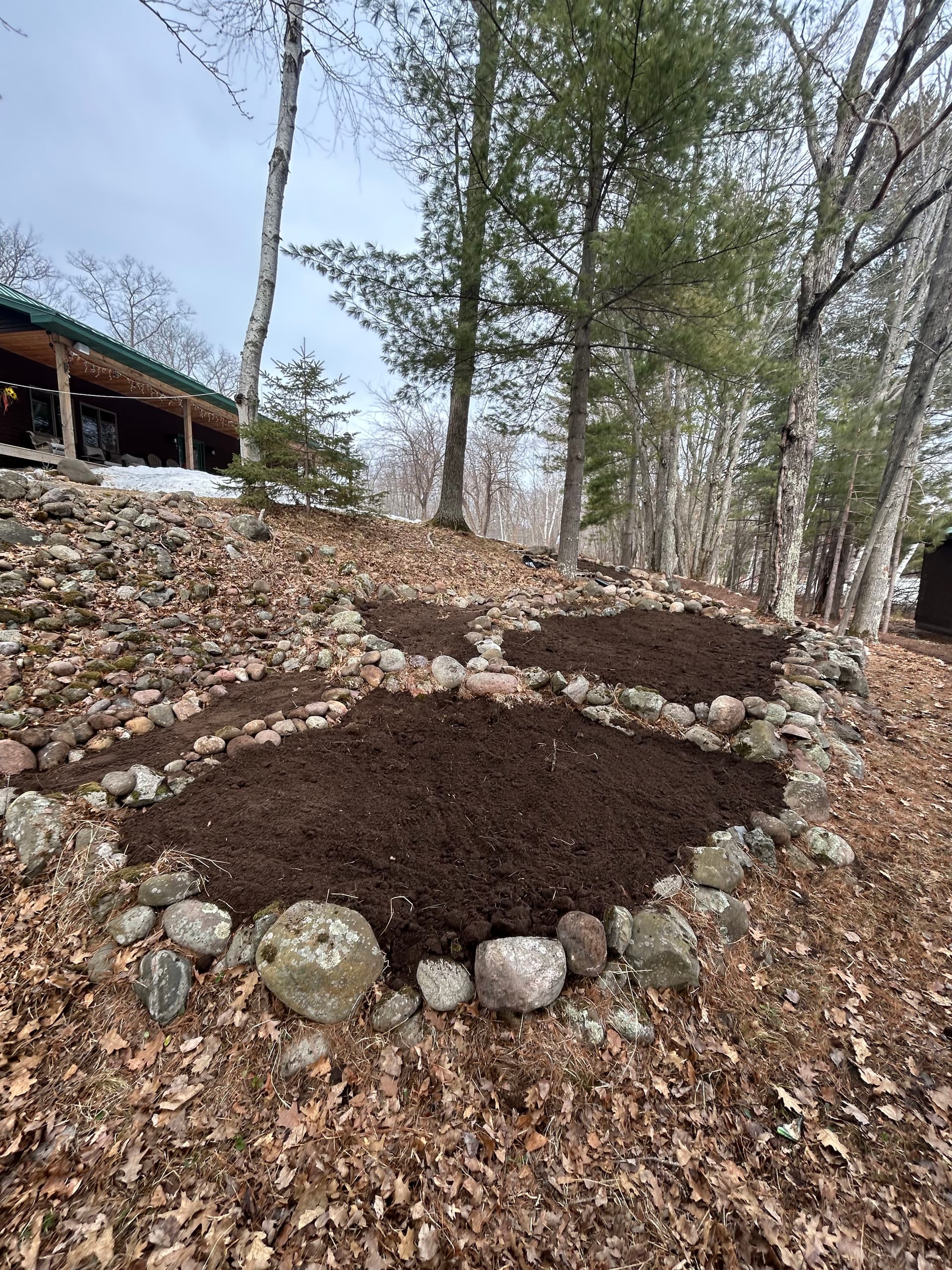 Garden Bed Construction and Stone Edging at a Wooded Cabin Property