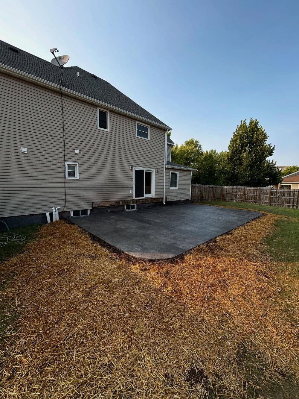 Old Wooden Deck Replaced with Rock-Stamped Concrete Patio